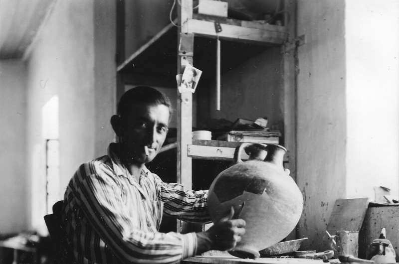Emin Kani Barin, a laborer from Albania, holds one of the pots he helped repair at Troy. A new paper by University of Cincinnati Archivist Jeff Kramer examines the important but unheralded role workers played in the 1930s excavation. Credit: UC Classics Archivist explores Troy's invisible workers