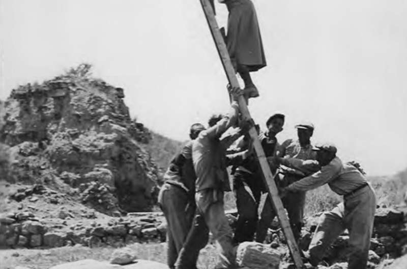 University of Cincinnati archaeologist Marion Rawson gets some help from workers to take video of Troy from atop a ladder. Credit: UC Classics Archivist explores Troy's invisible workers